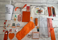 Orange book lover gift bundle with bookmarks, pens, sticky notes, socks and more